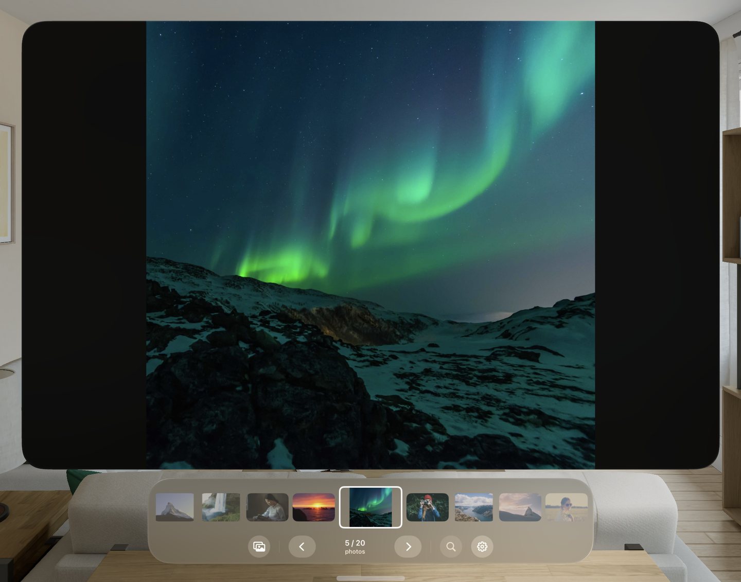 Northern lights over snowy hills