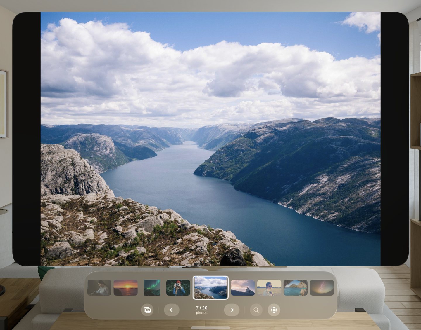 A fjord photo filling the window, filmstrip below
