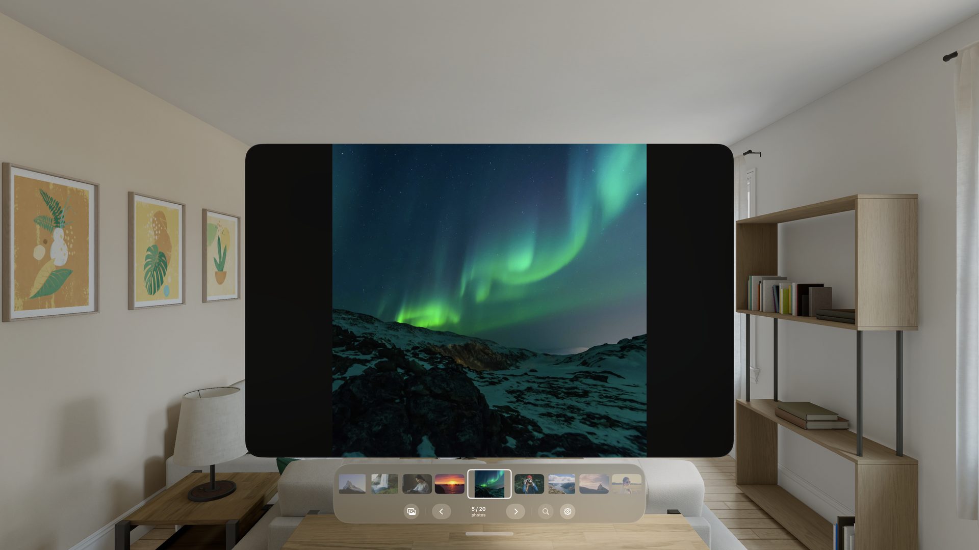 Vision Pro ImageViewer showing a photo of the northern lights in a large window, with a filmstrip of thumbnails floating below it