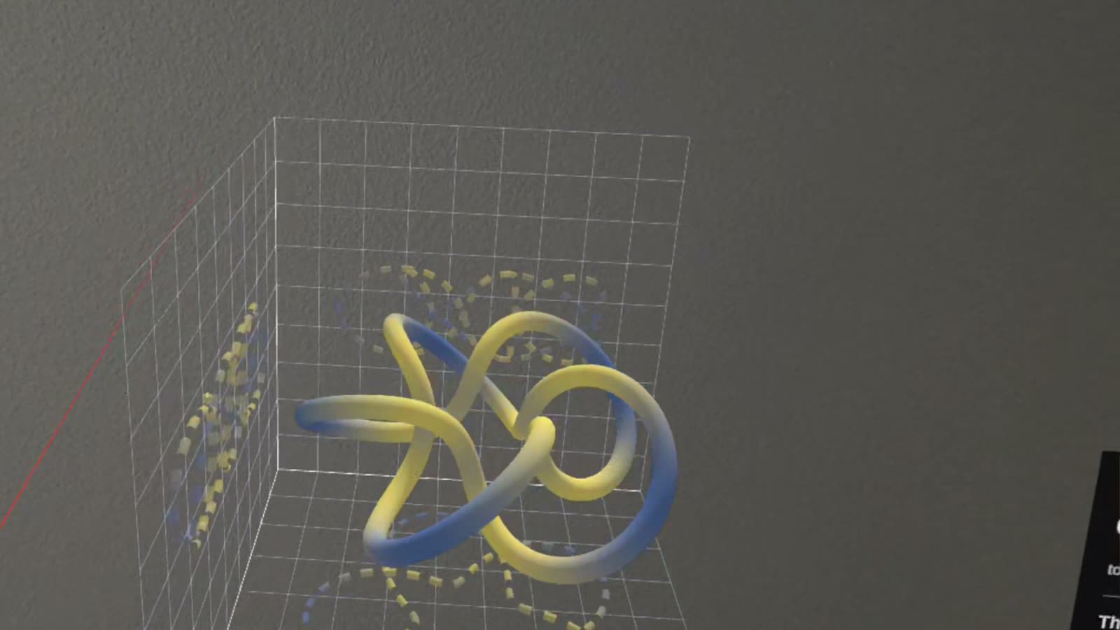 The cinquefoil knot in its coordinate box, standing in a real room on Quest